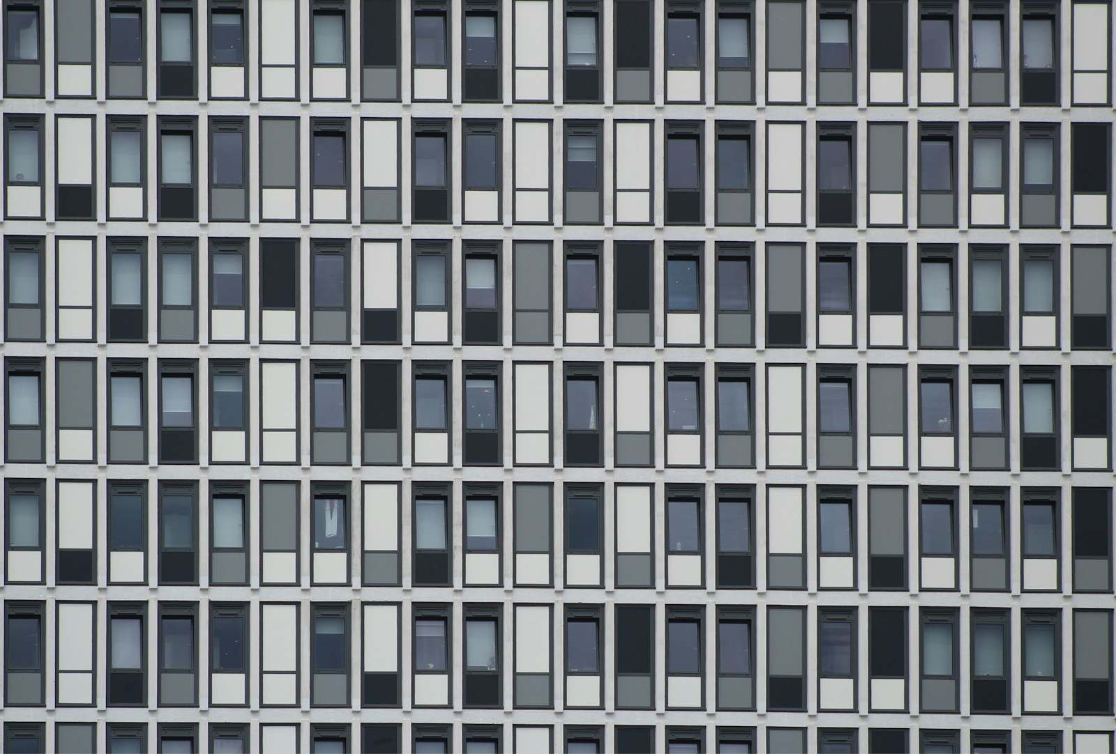 Repeating window and panel modules on a facade in Portsmouth.